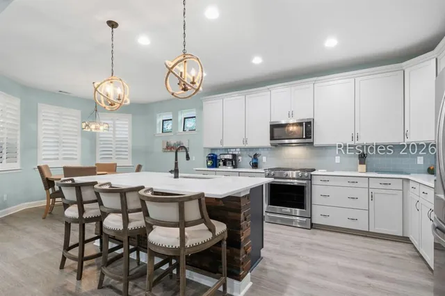 Kitchen island and pendant lighting at 1217 St. Somewhere Drive