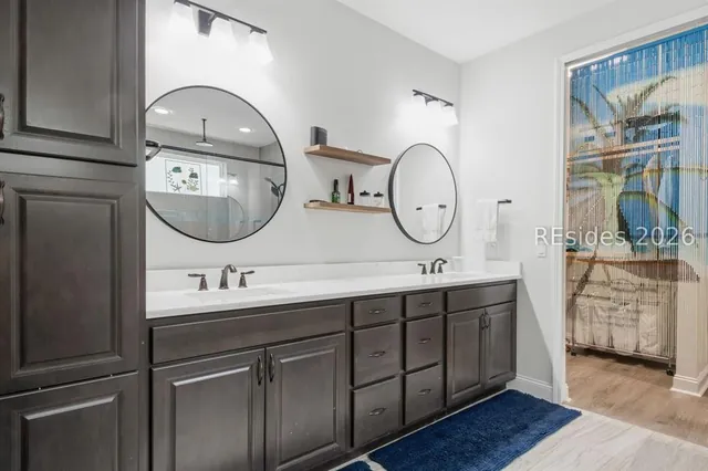 Primary bathroom with double vanity at 1217 St. Somewhere Drive