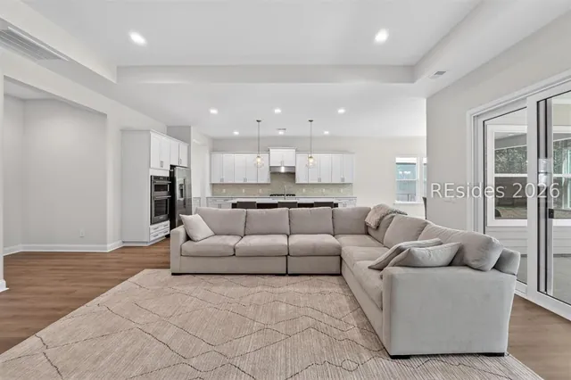 Open living and kitchen area at 1628 Laurel Oak Avenue