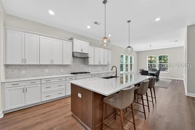 Kitchen with quartz island at 1628 Laurel Oak Avenue