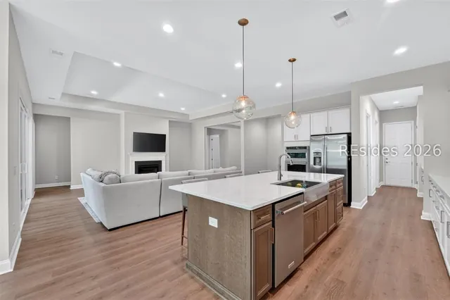 Kitchen island and pendant lighting at 1628 Laurel Oak Avenue