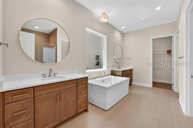 Primary bathroom with freestanding tub at 1628 Laurel Oak Avenue