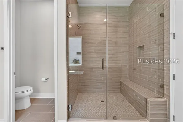 Tiled walk-in shower at 1628 Laurel Oak Avenue