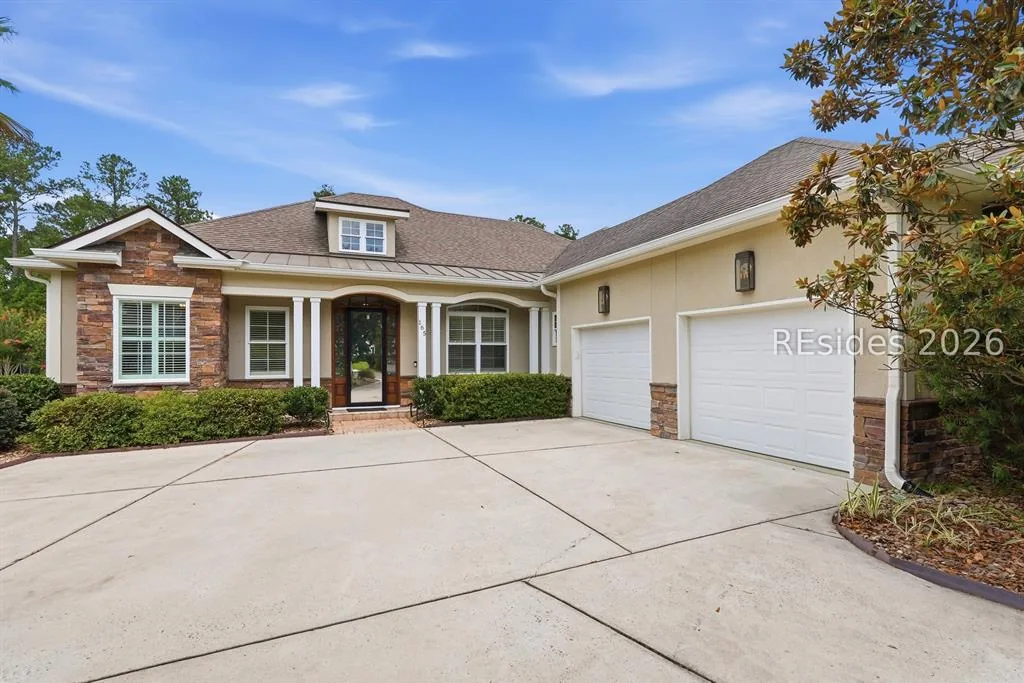 Front elevation and driveway at 165 Topside E, Latitude Lakes, Hardeeville SC
