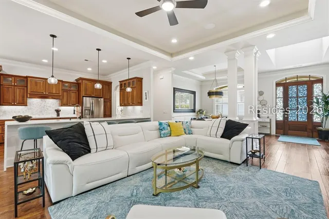 Open great room with coffered ceiling at 165 Topside E