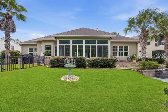 Rear elevation and lawn at 165 Topside E