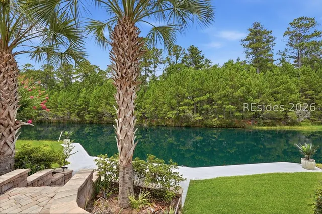 Lagoon frontage and palms at 165 Topside E