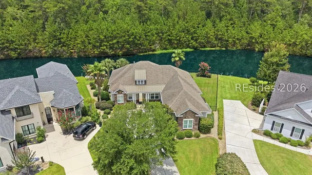 Aerial of the home and its waterfront lot at 165 Topside E