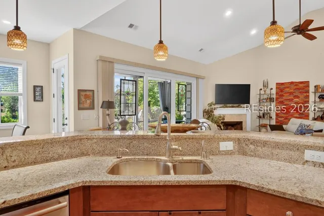 Curved breakfast bar open to the living area at 174 Slack Tide Drive