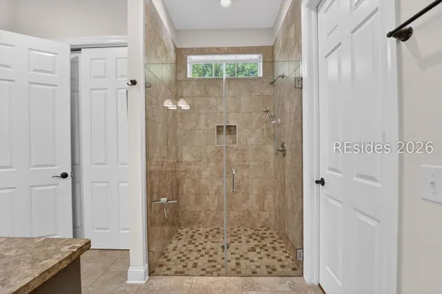 Tiled walk-in shower at 174 Slack Tide Drive