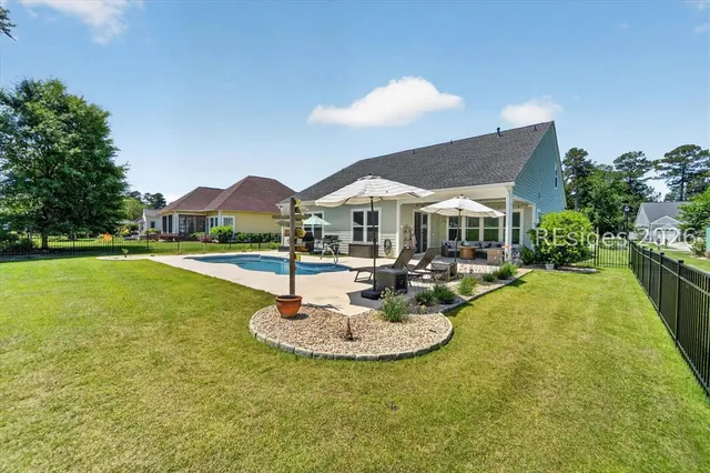 Private pool and rear elevation at 246 Laurel Oak Avenue