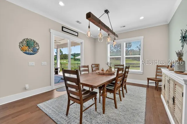 Dining area with statement lighting at 246 Laurel Oak Avenue