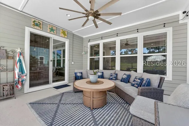 Screened porch with lounge seating at 246 Laurel Oak Avenue