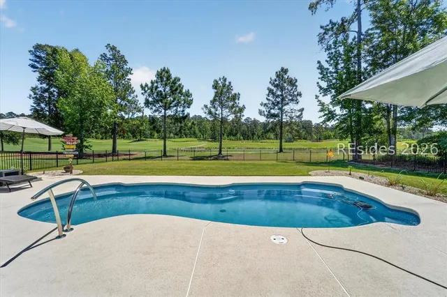 Resort-style pool in the private backyard at 246 Laurel Oak Avenue