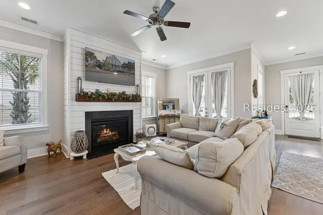 Open great room with fireplace and built-ins at 5 Caspian Lane