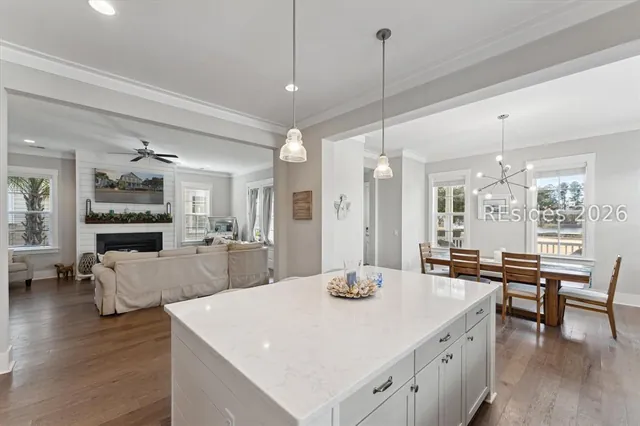 Kitchen with quartz island open to the dining area at 5 Caspian Lane