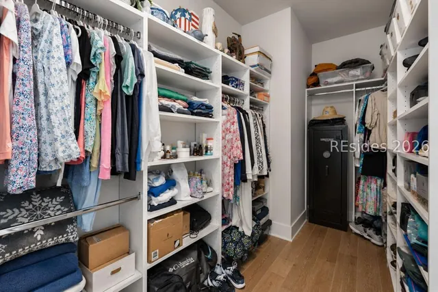 Fitted walk-in closet in the primary suite at 5 Caspian Lane