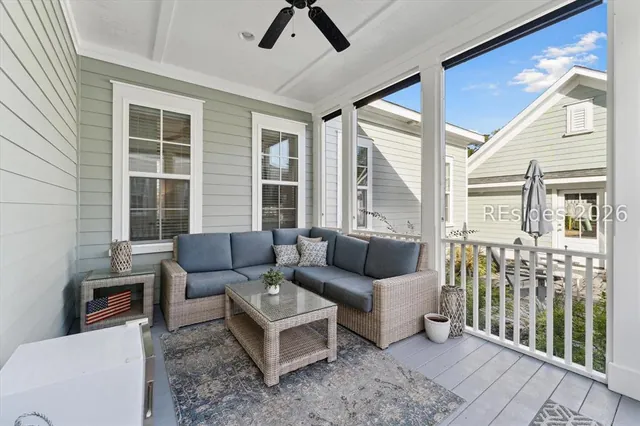 Screened porch with lounge seating at 5 Caspian Lane