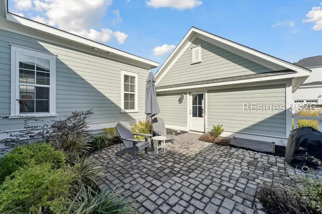Paver courtyard and detached two-car garage at 5 Caspian Lane